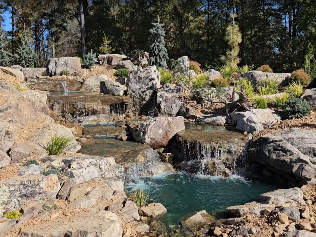 Unionville multi-tier boulder waterfall and pond